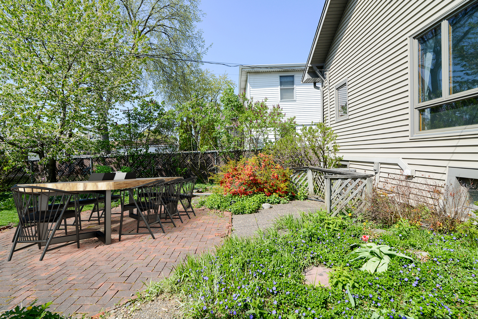 4162 Blanchan Avenue Brookfield, IL 60513 - Photo 38 of 39 a patio with table and chairs and potted plants
