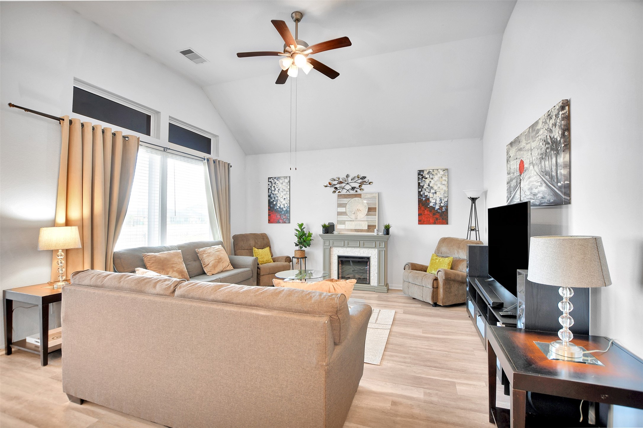 27 Montecito Lane Manvel, TX 77578 - Photo 11 of 49 a living room with furniture a flat screen tv and a large window