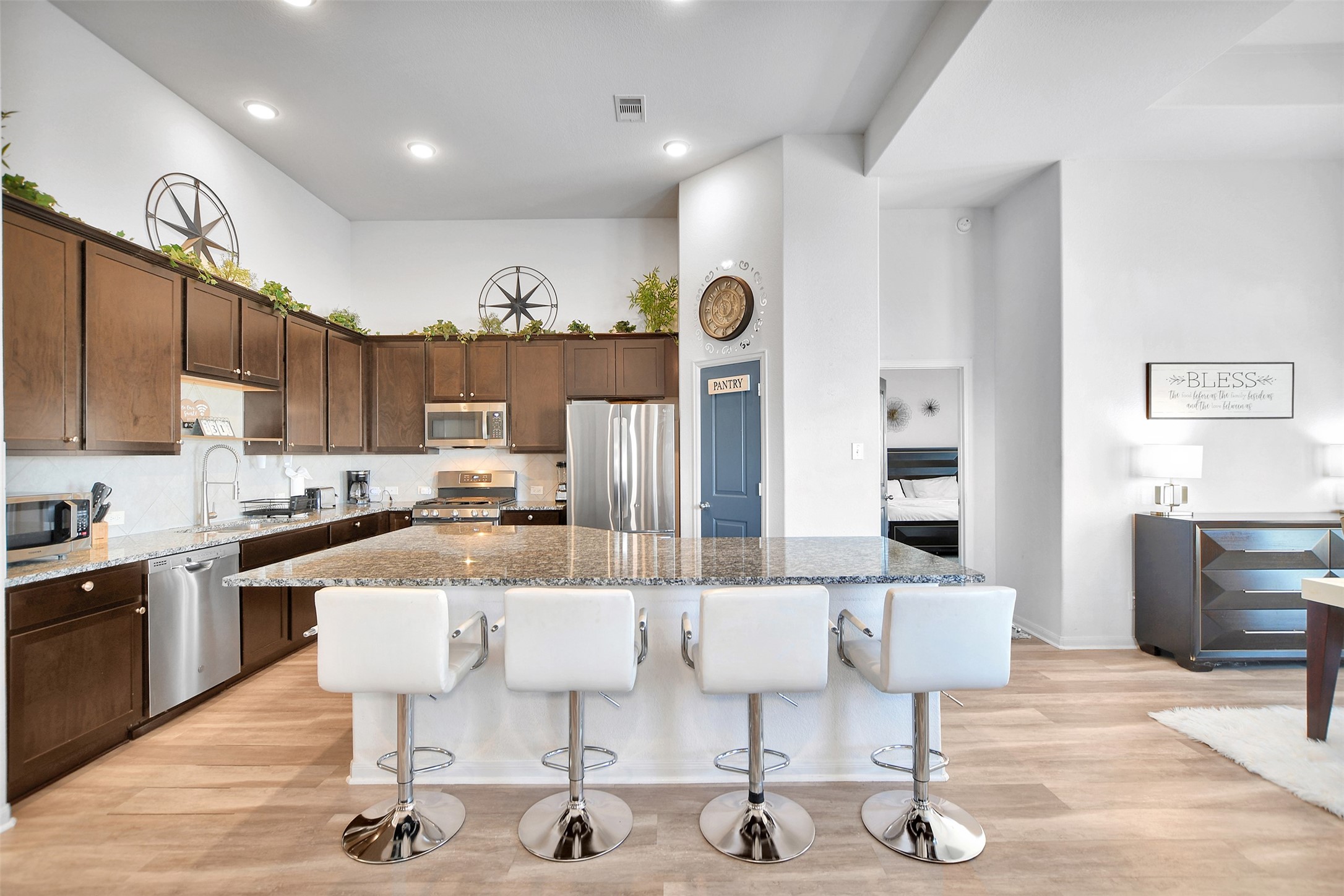 27 Montecito Lane Manvel, TX 77578 - Photo 17 of 49 a living room with lots of furniture and kitchen view