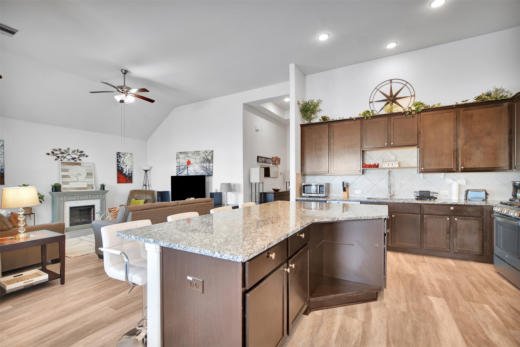 27 Montecito Lane Manvel, TX 77578 - Photo 19 of 49 a kitchen with granite countertop a sink appliances and cabinets