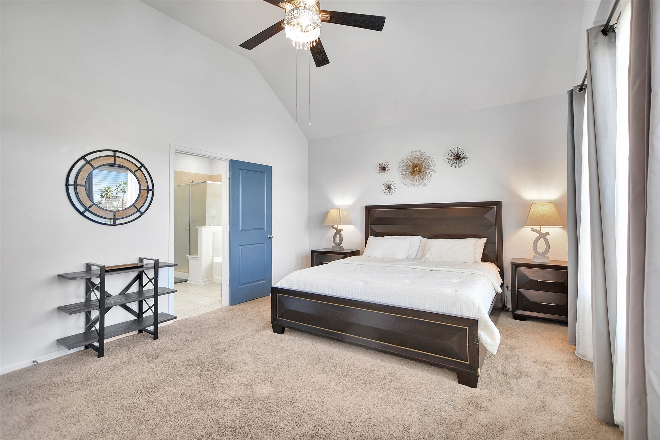 27 Montecito Lane Manvel, TX 77578 - Photo 27 of 49 a bedroom with a bed a chair and a chandelier