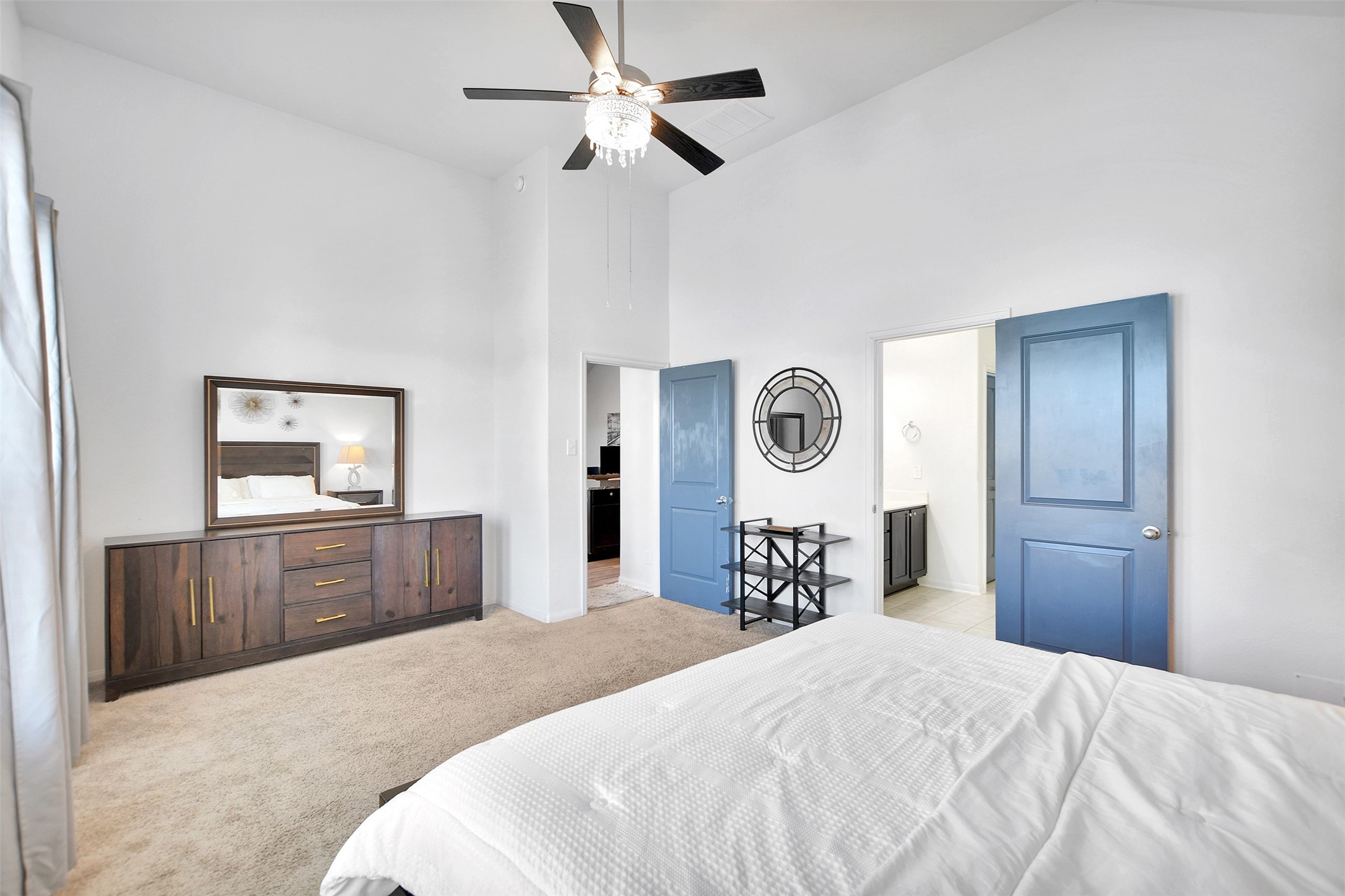 27 Montecito Lane Manvel, TX 77578 - Photo 28 of 49 a bedroom with bed and dresser with mirror