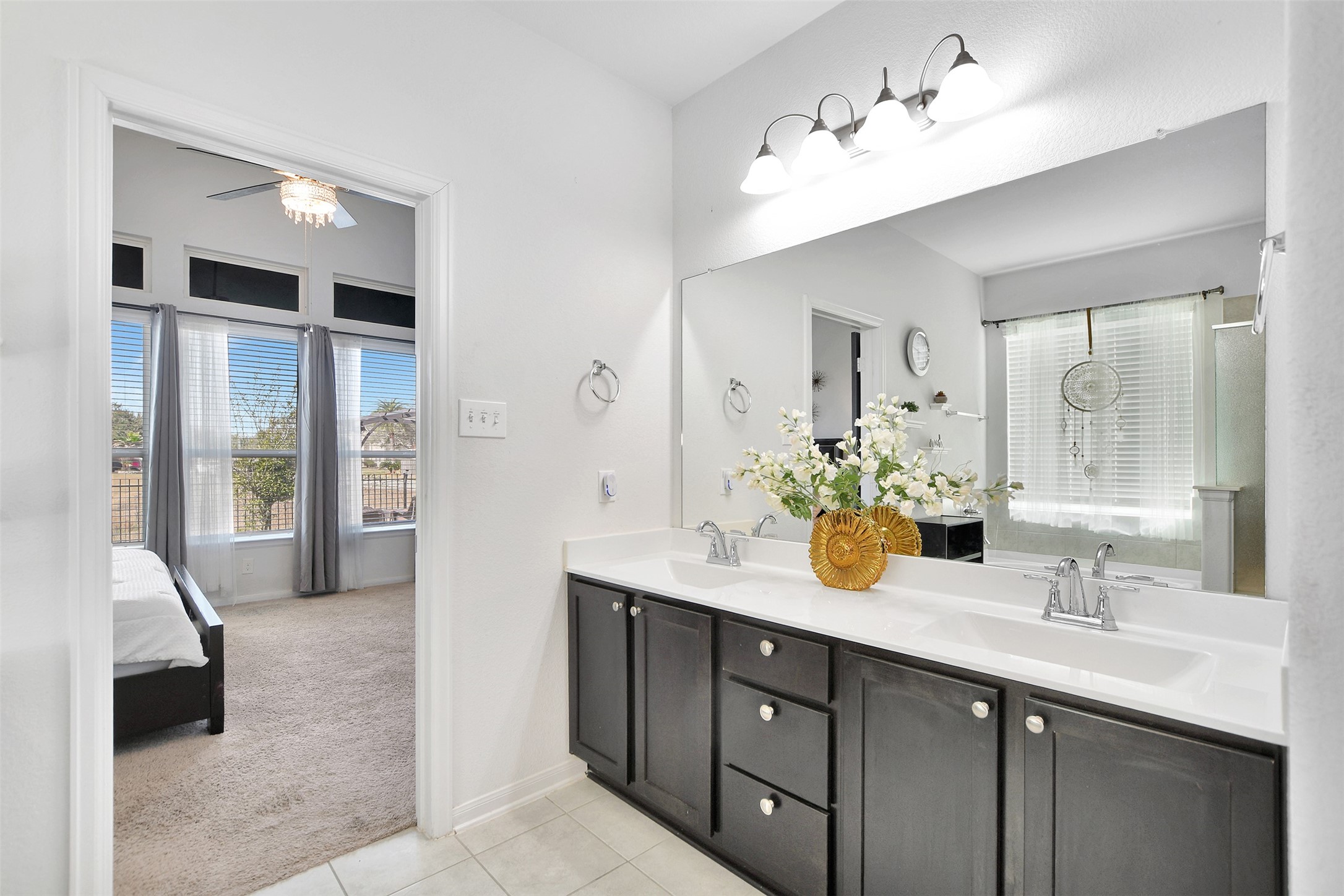 27 Montecito Lane Manvel, TX 77578 - Photo 30 of 49 a spacious bathroom with a double vanity sink and a mirror