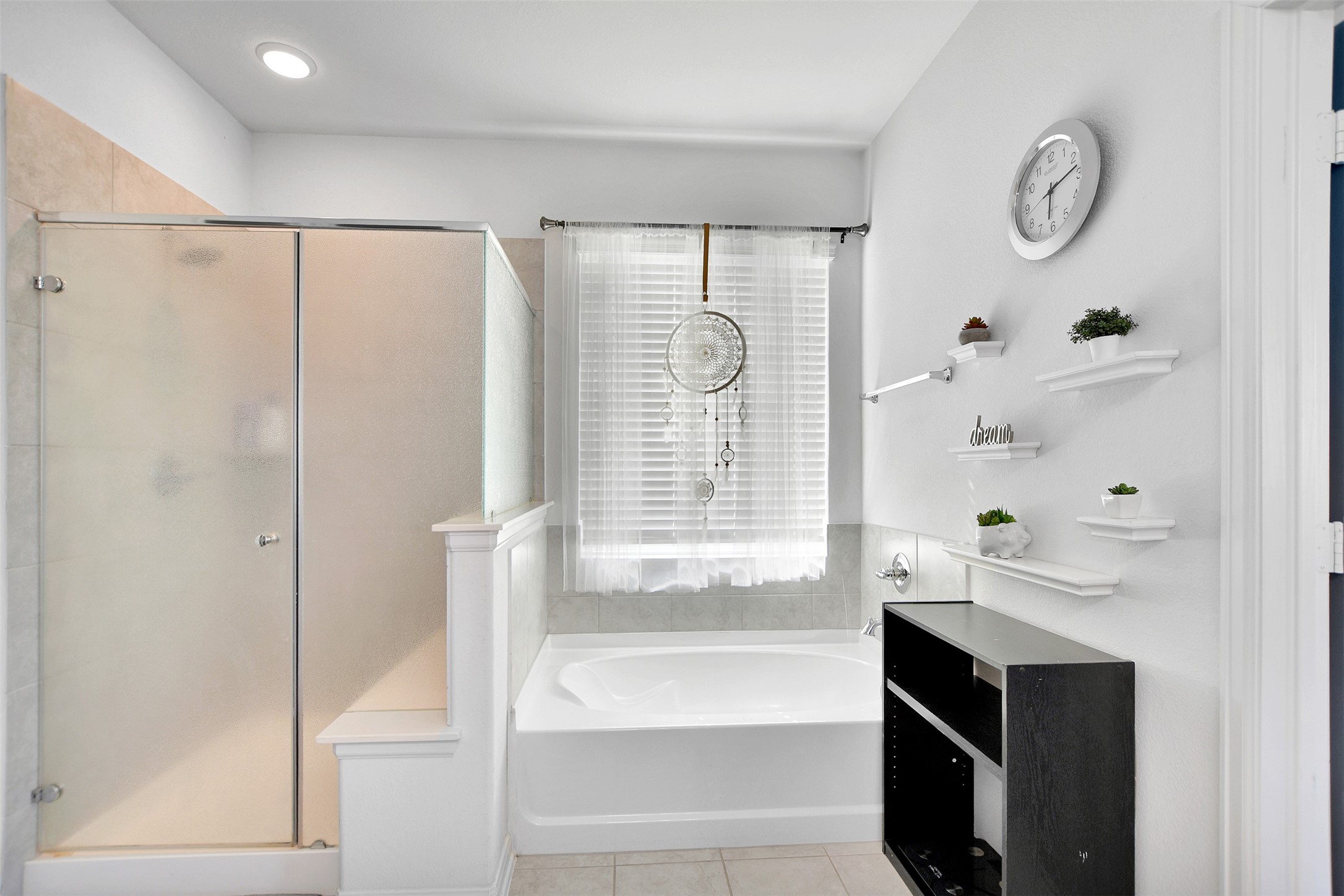 27 Montecito Lane Manvel, TX 77578 - Photo 31 of 49 a bathroom with a bathtub and a shower