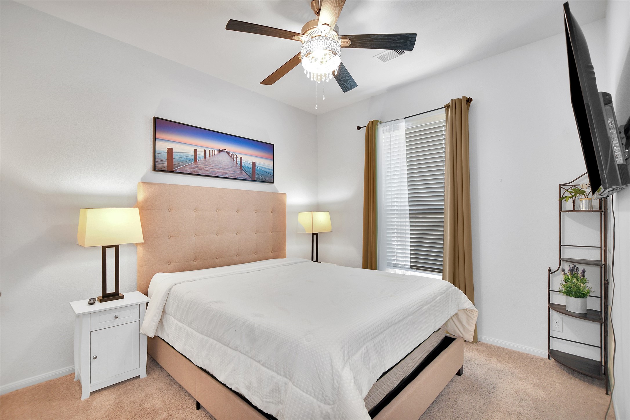 27 Montecito Lane Manvel, TX 77578 - Photo 33 of 49 a bedroom with a bed and a lamp on table