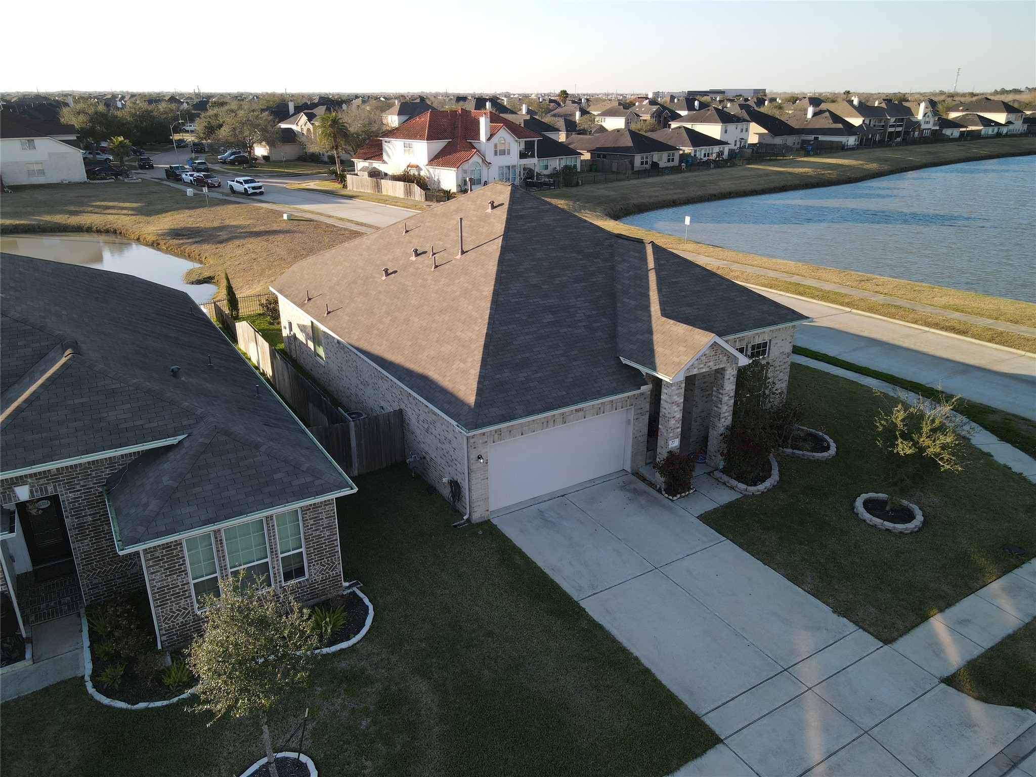 27 Montecito Lane Manvel, TX 77578 - Photo 46 of 49 a view of a terrace with wooden floor and ocean view
