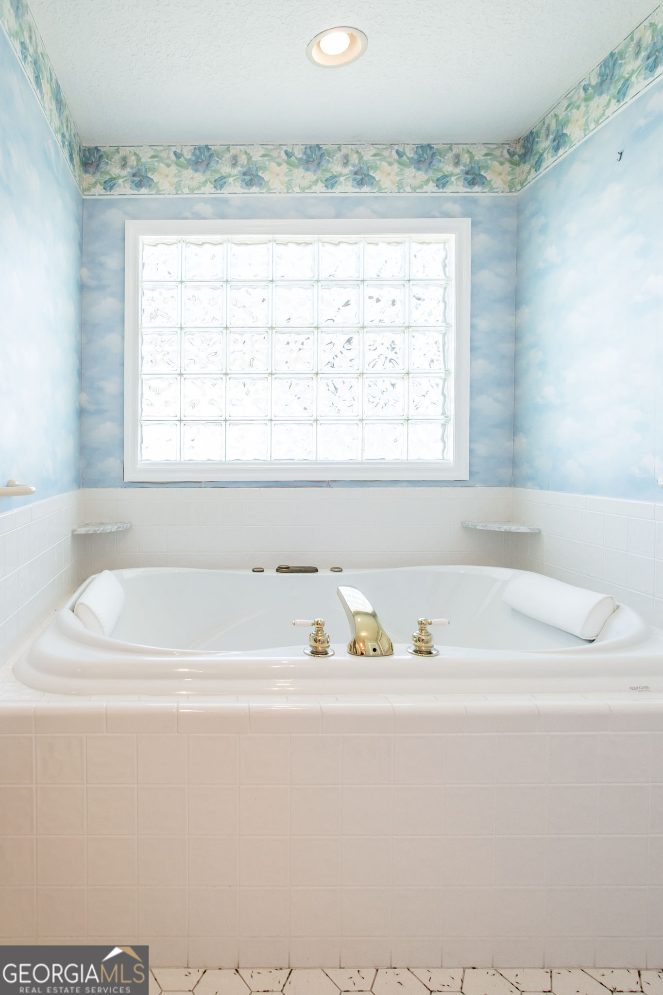 402 Preston Street Waycross, GA 31501 - Photo 35 of 43 a bathroom with a bathtub and a window