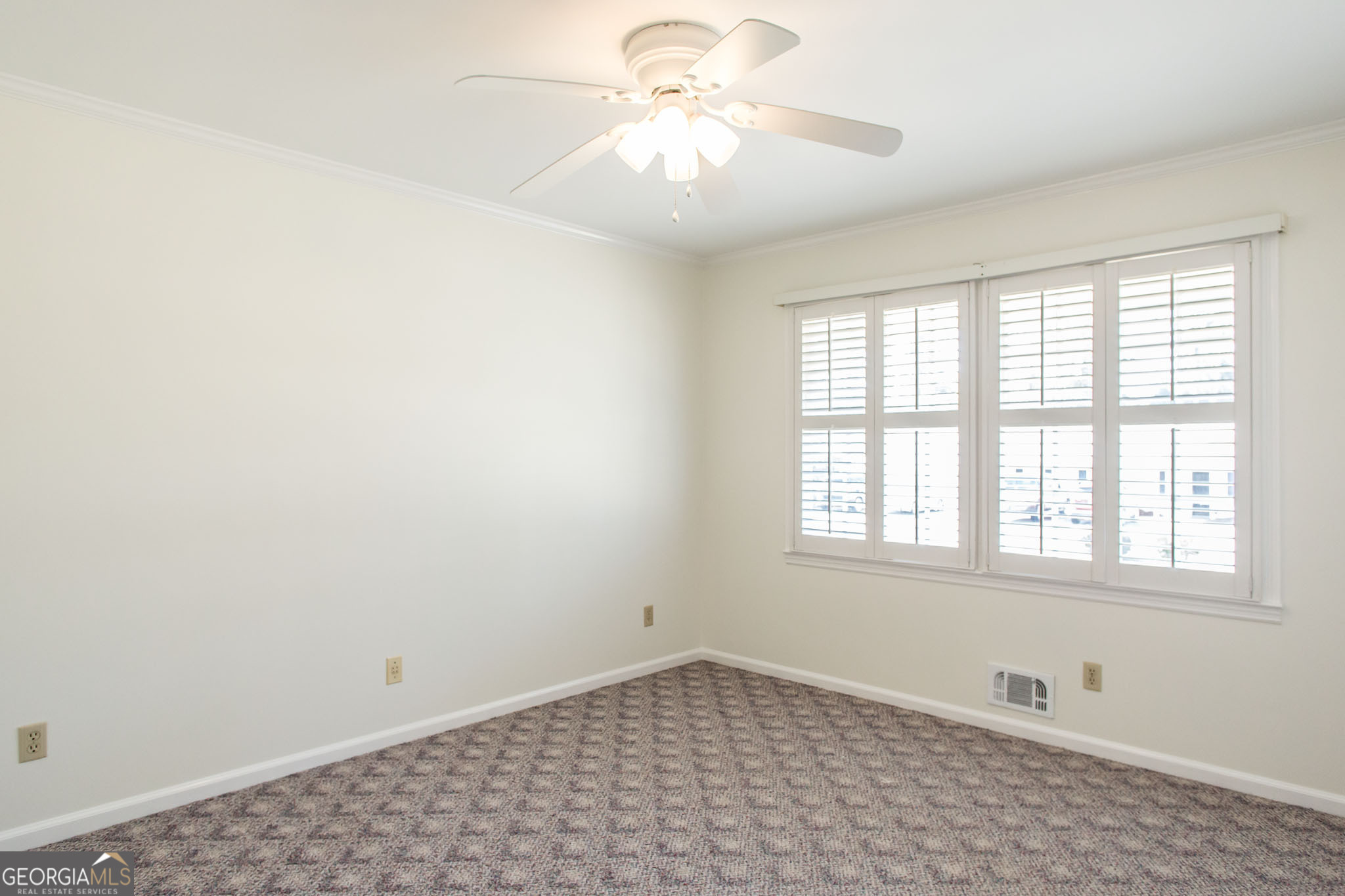 402 Preston Street Waycross, GA 31501 - Photo 36 of 43 a view of an empty room with a window