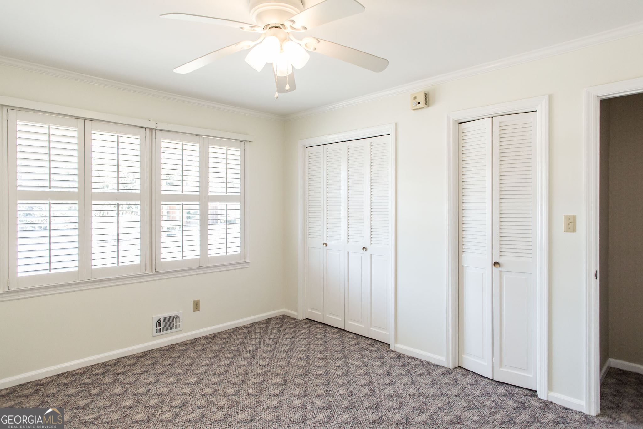 402 Preston Street Waycross, GA 31501 - Photo 37 of 43 a view of an empty room with a window