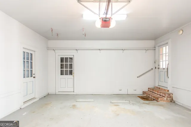 a view of a large house with a yard and large trees