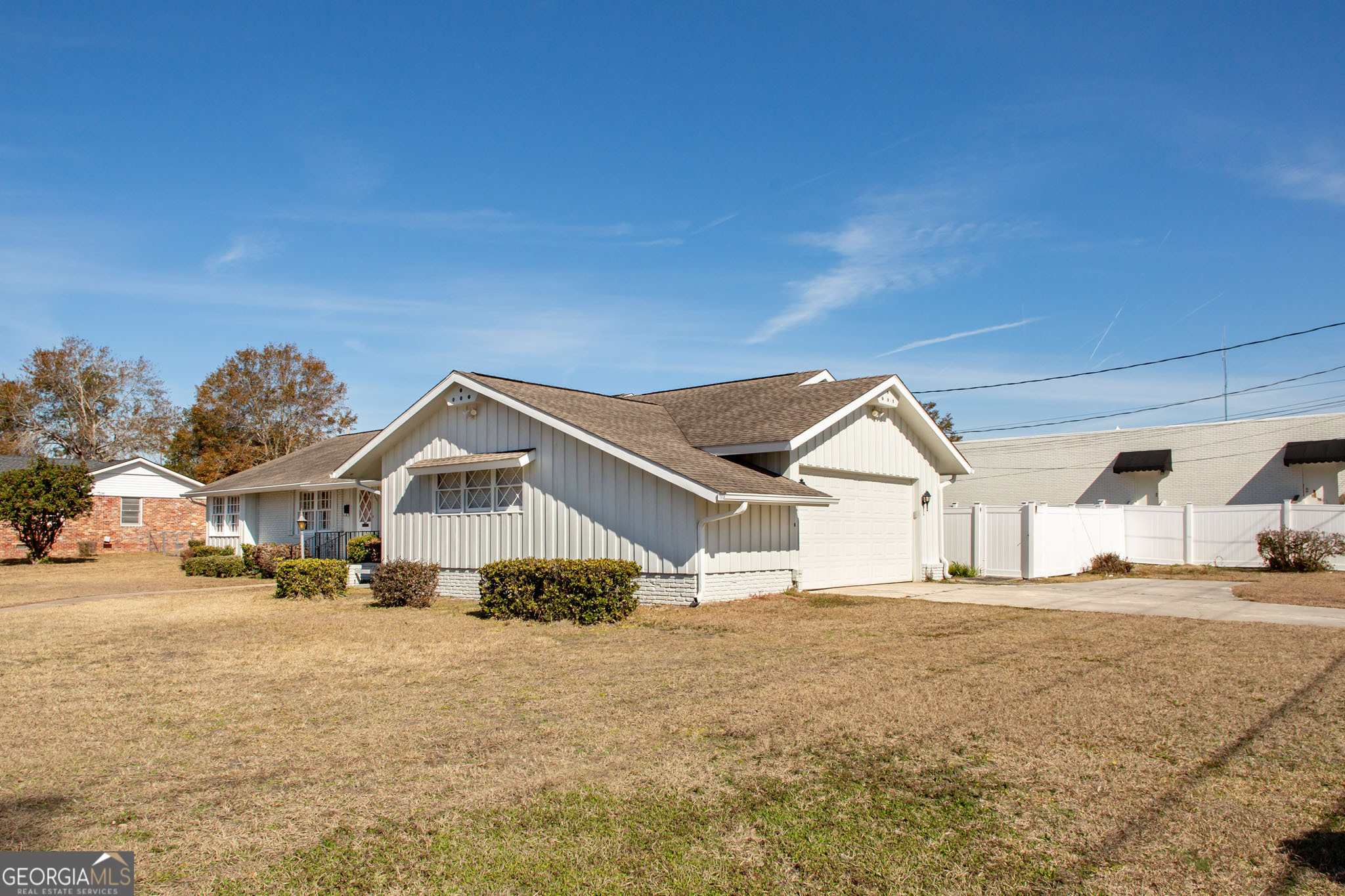 402 Preston Street Waycross, GA 31501 - Photo 41 of 43 a view of a large house with a yard and large trees