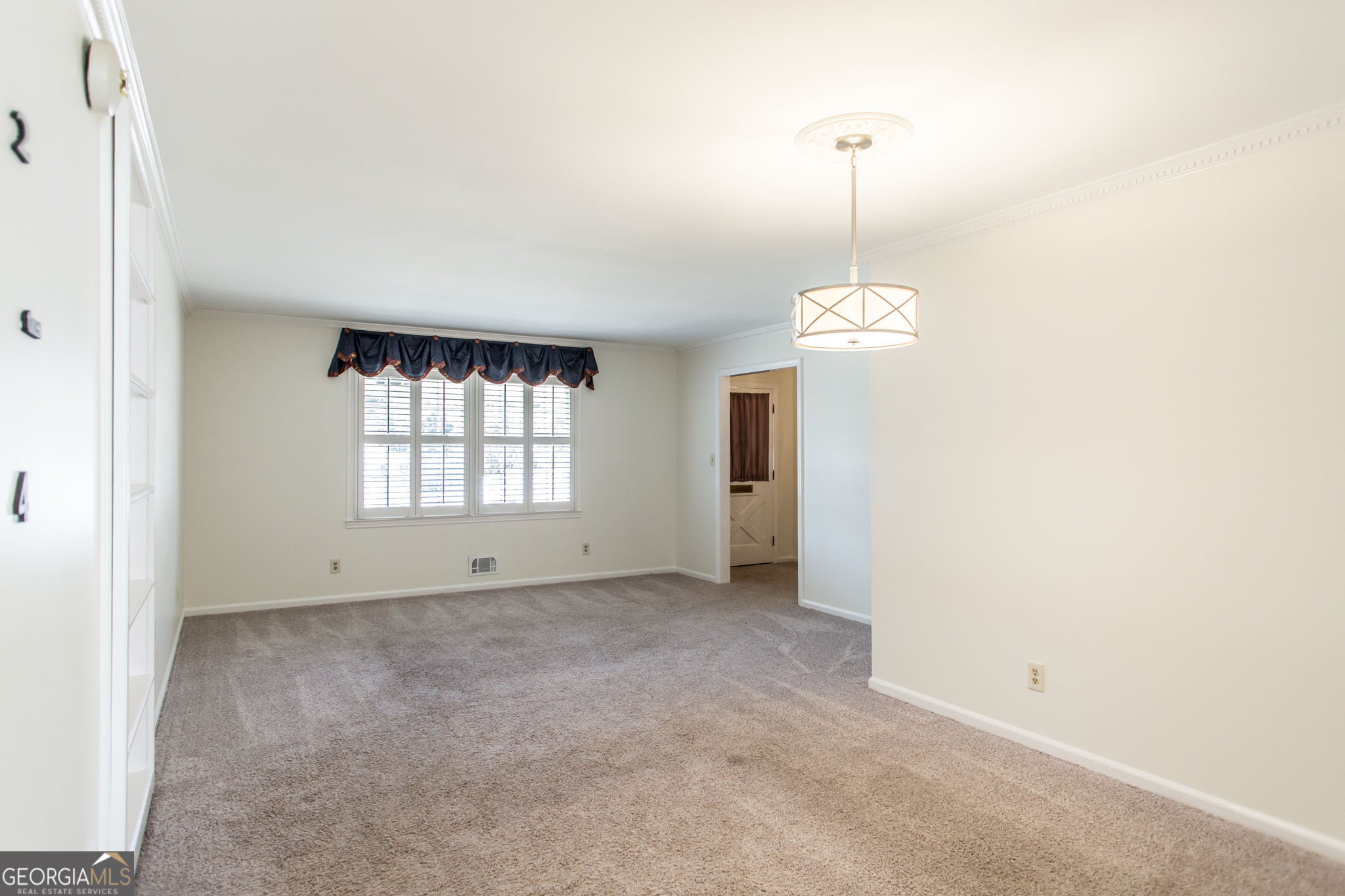 402 Preston Street Waycross, GA 31501 - Photo 8 of 43 a view of an empty room with a window