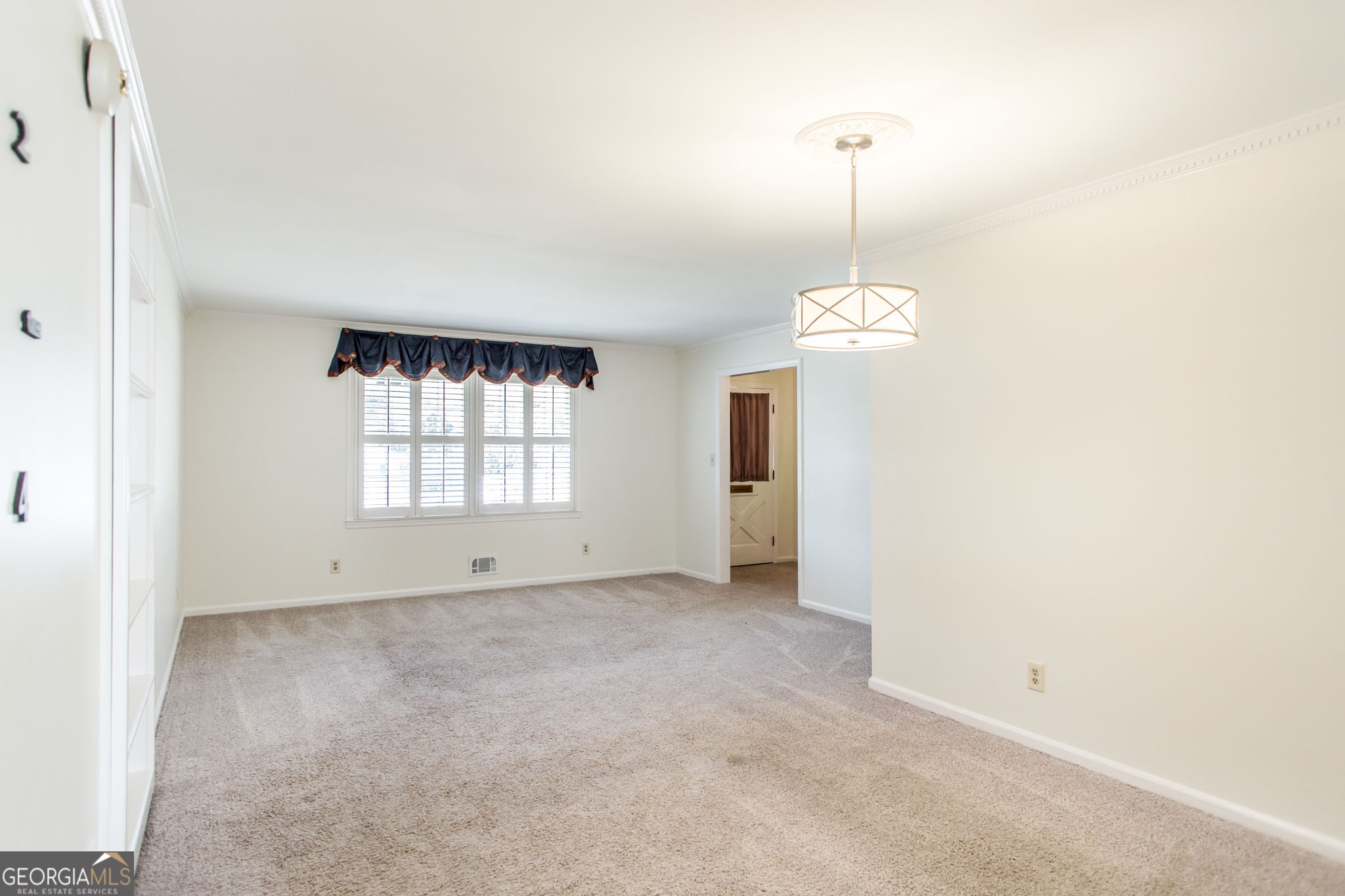 402 Preston Street Waycross, GA 31501 - Photo 9 of 43 a view of an empty room with a window