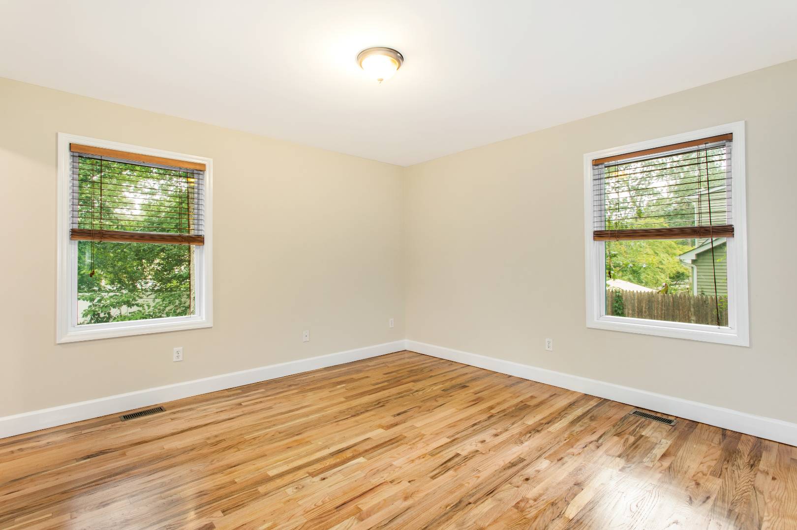 123 Flanders Blouevard Flanders, NY 11901 - Photo 6 of 7 a view of an empty room with wooden floor and a window