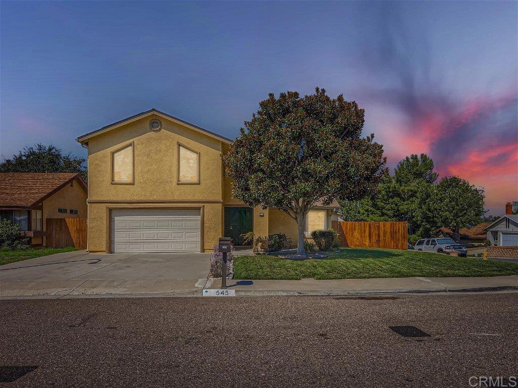 545 Kurdson Way Spring Valley, CA 91977 - Photo 1 of 1 a front view of a house with a yard and garage
