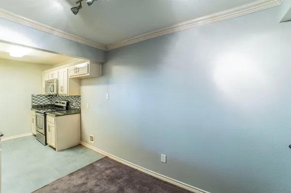 a view of storage and utility room with closet