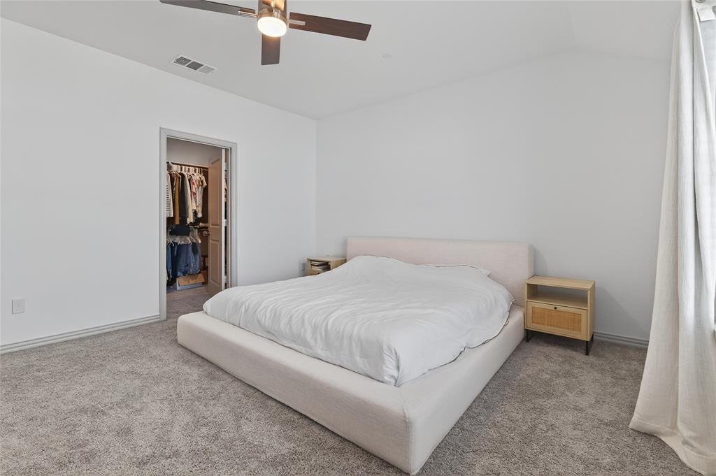 9000 Phoebe Road Frisco, TX 75035 - Photo 21 of 27 a bed room with a bed and a ceiling fan