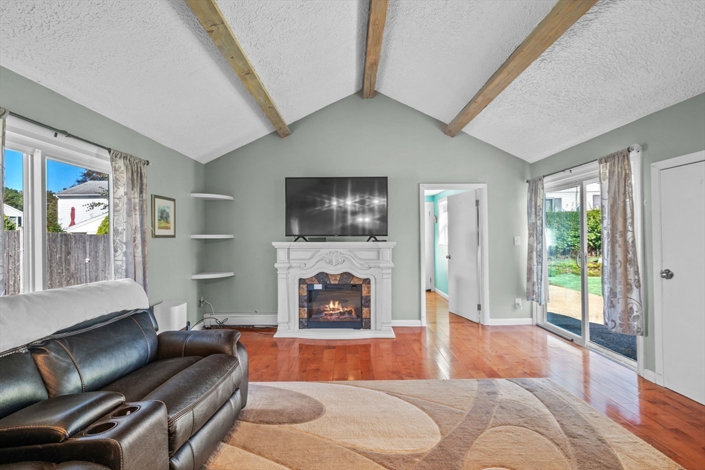 1 Reed Road Peabody, MA 01960 - Photo 13 of 31 a living room with furniture and a fireplace