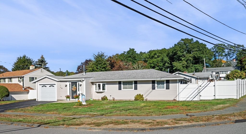 1 Reed Road Peabody, MA 01960 - Photo 2 of 31 a view of a white house with a big yard and large trees