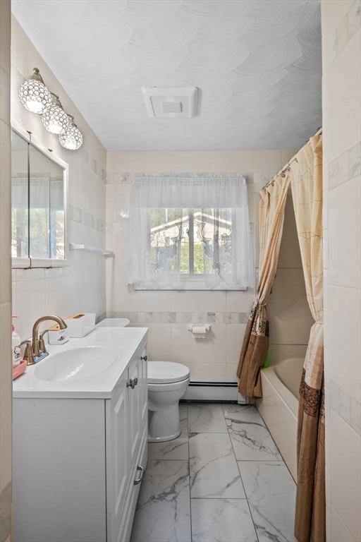 1 Reed Road Peabody, MA 01960 - Photo 23 of 31 a bathroom with a sink a toilet and a mirror