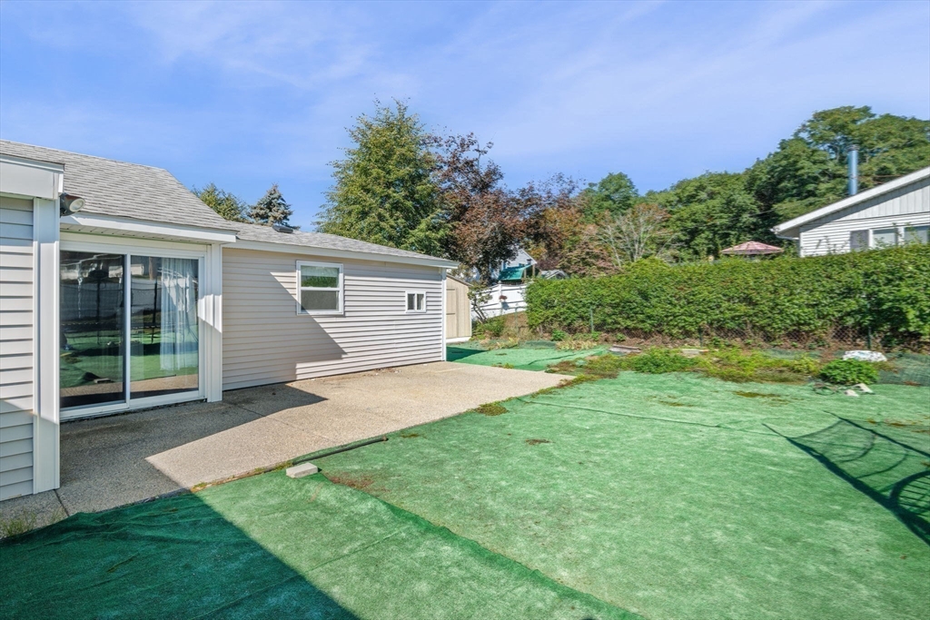 1 Reed Road Peabody, MA 01960 - Photo 29 of 31 a front view of a house with a yard and potted plants