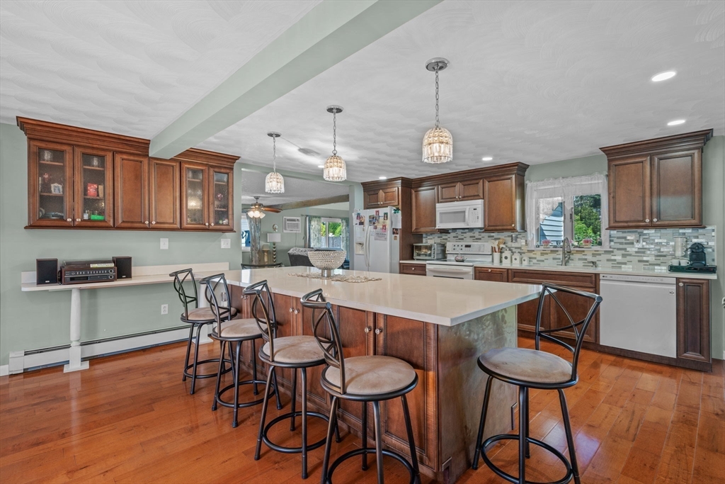1 Reed Road Peabody, MA 01960 - Photo 5 of 31 a large kitchen with a table and chairs