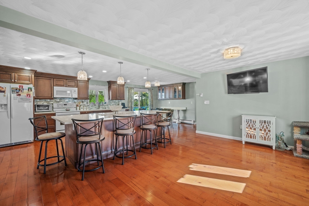 1 Reed Road Peabody, MA 01960 - Photo 7 of 31 a very nice looking living room with dining room and wooden floor