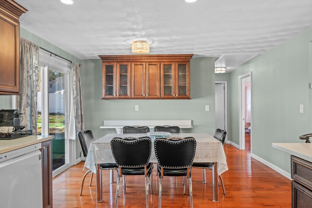 1 Reed Road Peabody, MA 01960 - Photo 9 of 31 a view of a dining room with furniture and wooden floor