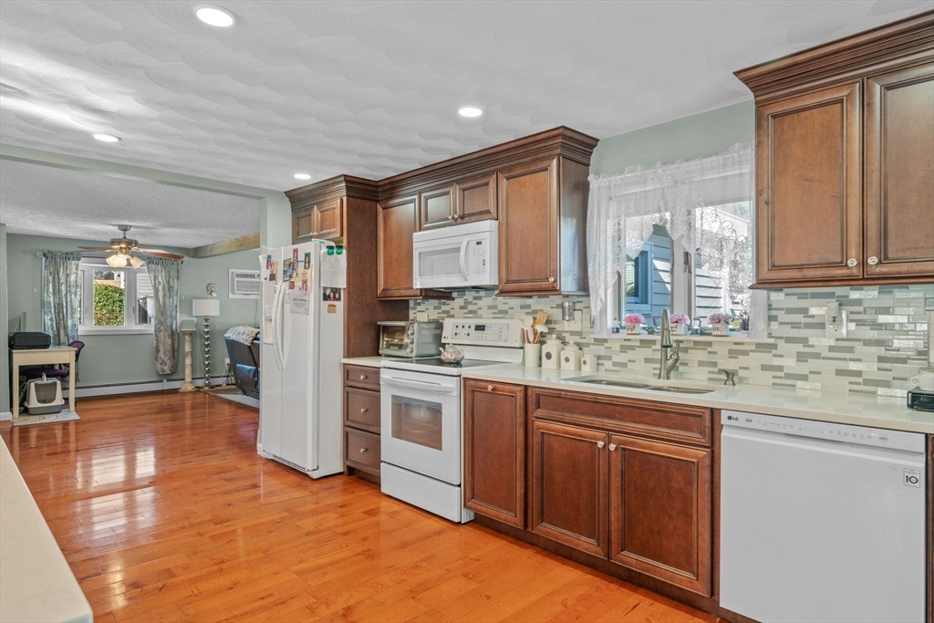 1 Reed Road Peabody, MA 01960 - Photo 10 of 31 a kitchen with stainless steel appliances granite countertop a refrigerator and a sink