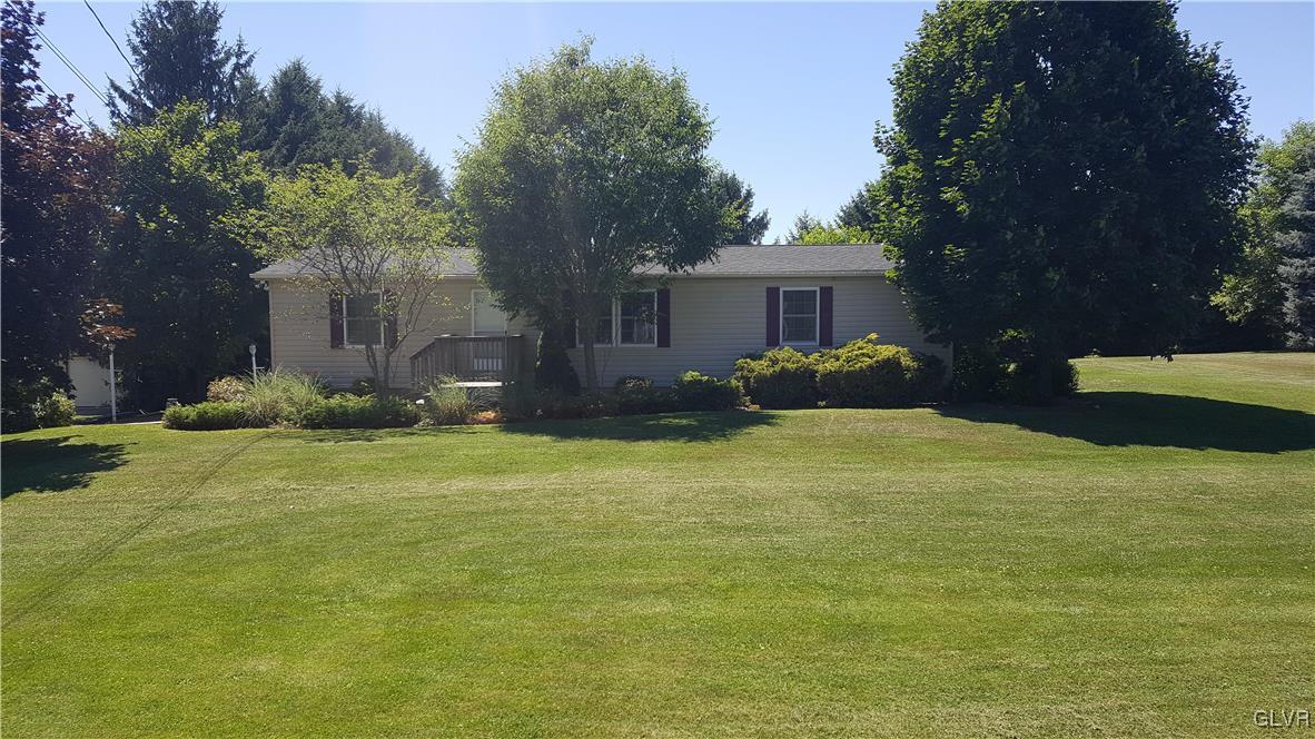 975 Bushkill Center Road Nazareth, PA 18064 - Photo 1 of 48 a front view of a house with garden