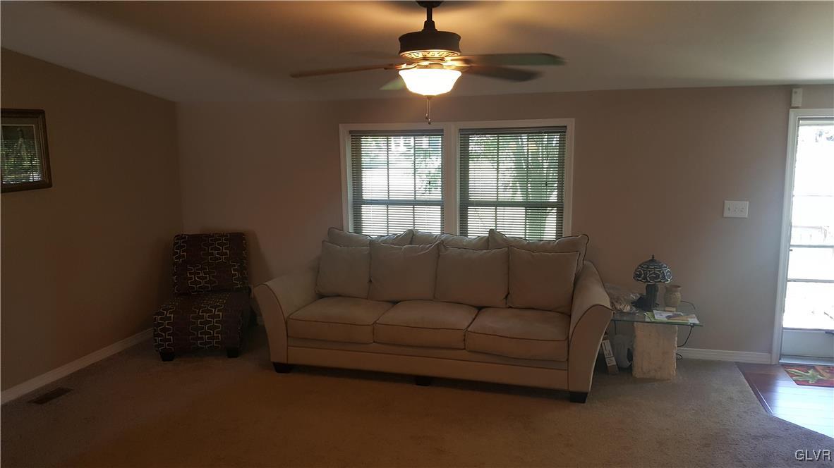 975 Bushkill Center Road Nazareth, PA 18064 - Photo 16 of 48 a living room with furniture chandelier and a window