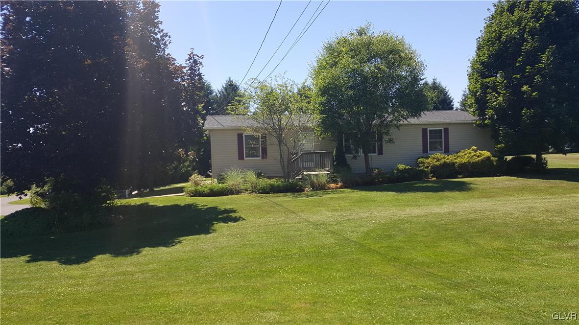 975 Bushkill Center Road Nazareth, PA 18064 - Photo 2 of 48 a backyard of a house with yard and outdoor seating