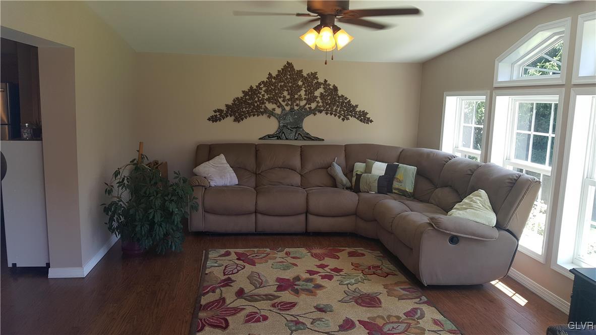 975 Bushkill Center Road Nazareth, PA 18064 - Photo 27 of 48 a living room with furniture and a chandelier