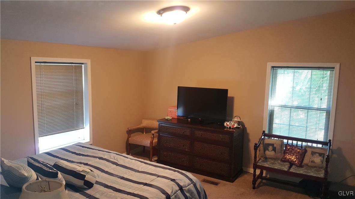 975 Bushkill Center Road Nazareth, PA 18064 - Photo 31 of 48 a bedroom with a bed and a television
