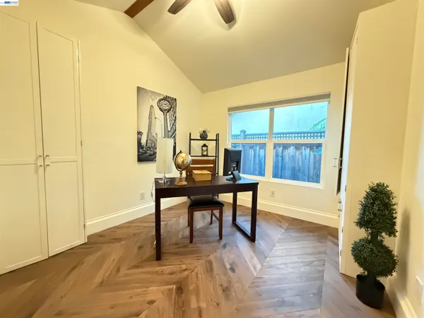 a view of a livingroom with furniture and wooden floor