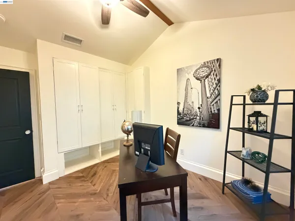 a view of a workspace with furniture