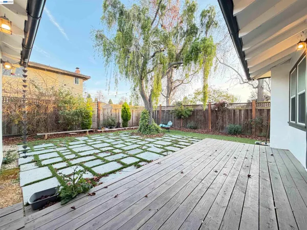a view of a backyard with wooden floor