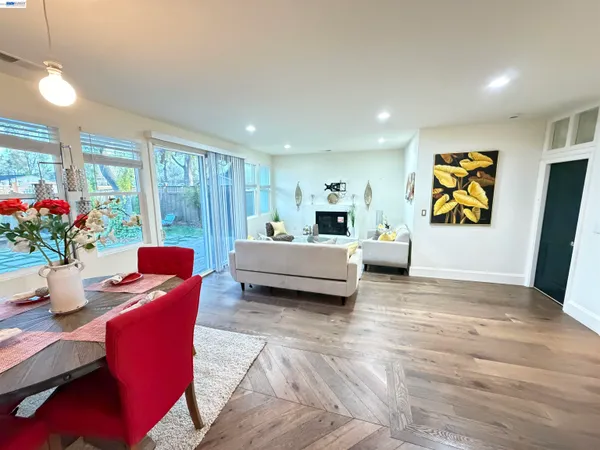 a living room with furniture and flowers