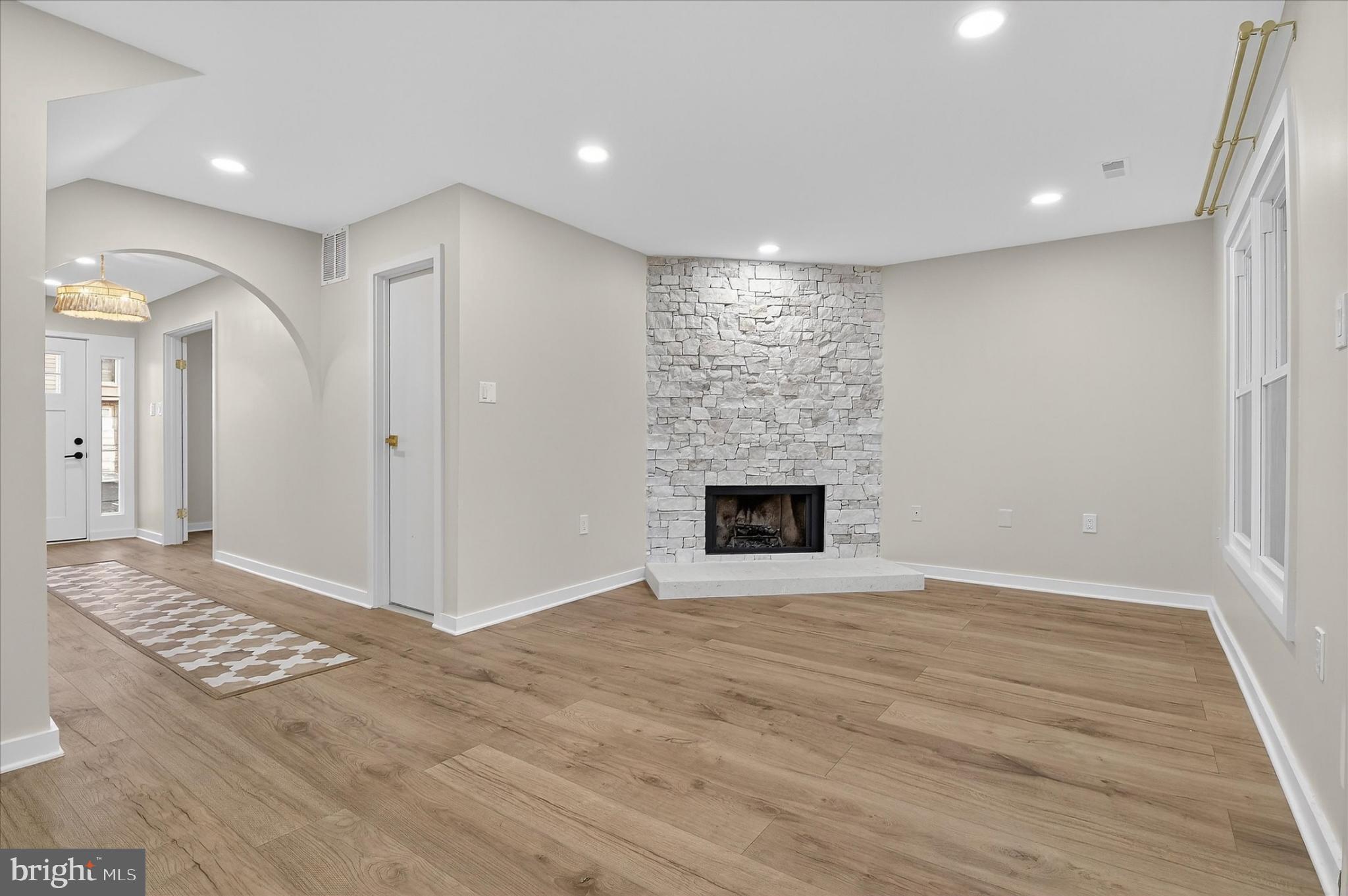 10502 Oronoco Lane Manassas, VA 20109 - Photo 13 of 37 a view of empty room with wooden floor and fireplace