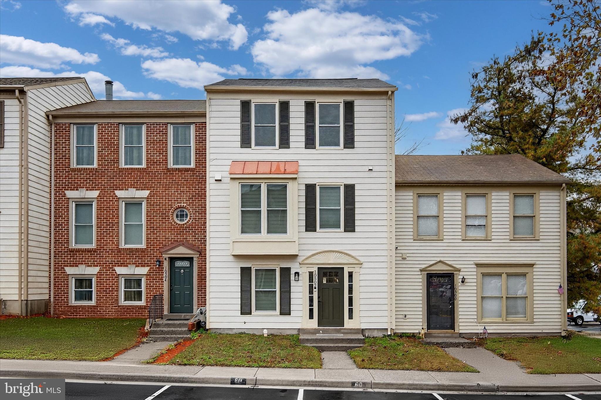 10502 Oronoco Lane Manassas, VA 20109 - Photo 2 of 37 a front view of a house with a yard