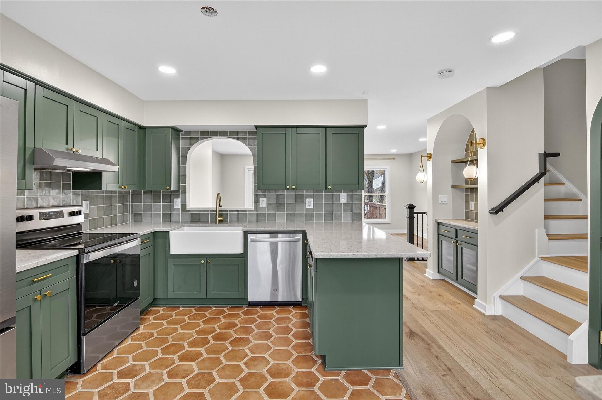 10502 Oronoco Lane Manassas, VA 20109 - Photo 22 of 37 a kitchen with granite countertop a sink a counter top space appliances and cabinets