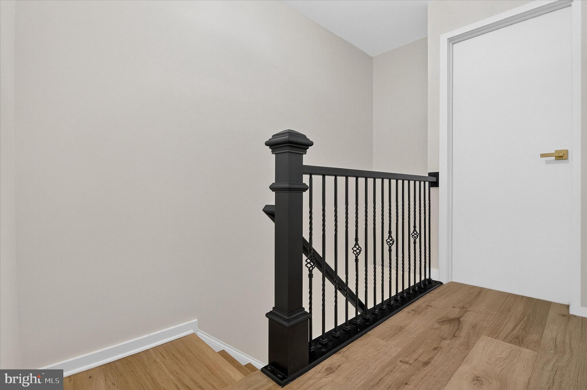 10502 Oronoco Lane Manassas, VA 20109 - Photo 26 of 37 a view of a hallway with wooden floor