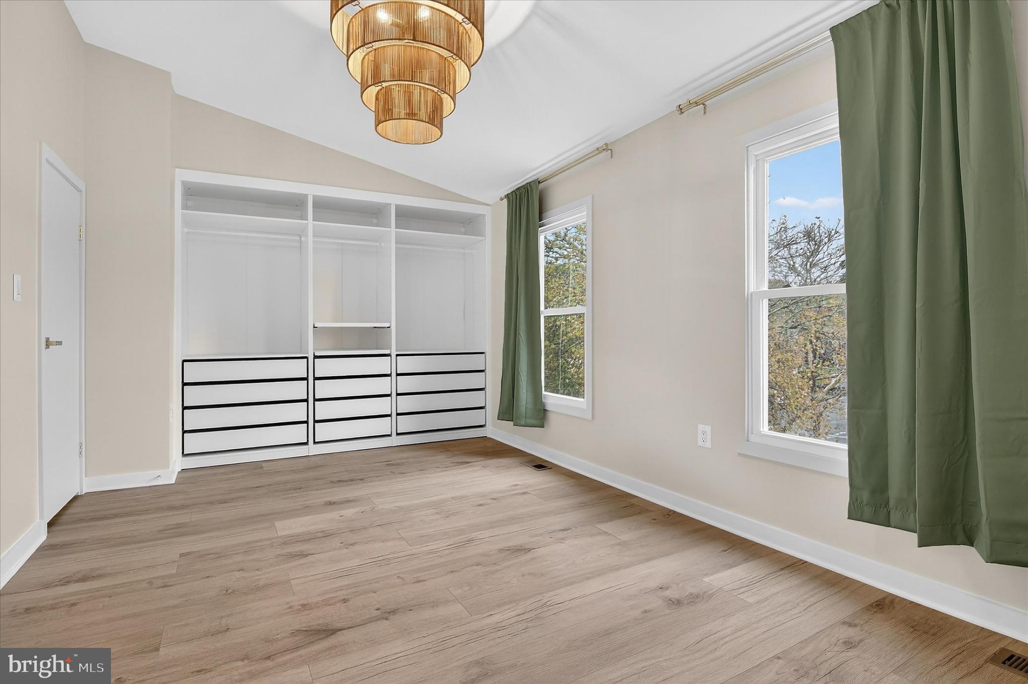 10502 Oronoco Lane Manassas, VA 20109 - Photo 33 of 37 a view of empty room with wooden floor and fan