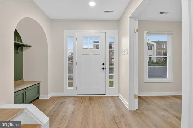 a view of entryway with wooden floor