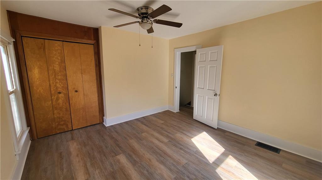 33 Orangeville Road Greenville, PA 16125 - Photo 12 of 15 a view of empty room with wooden floor and fan