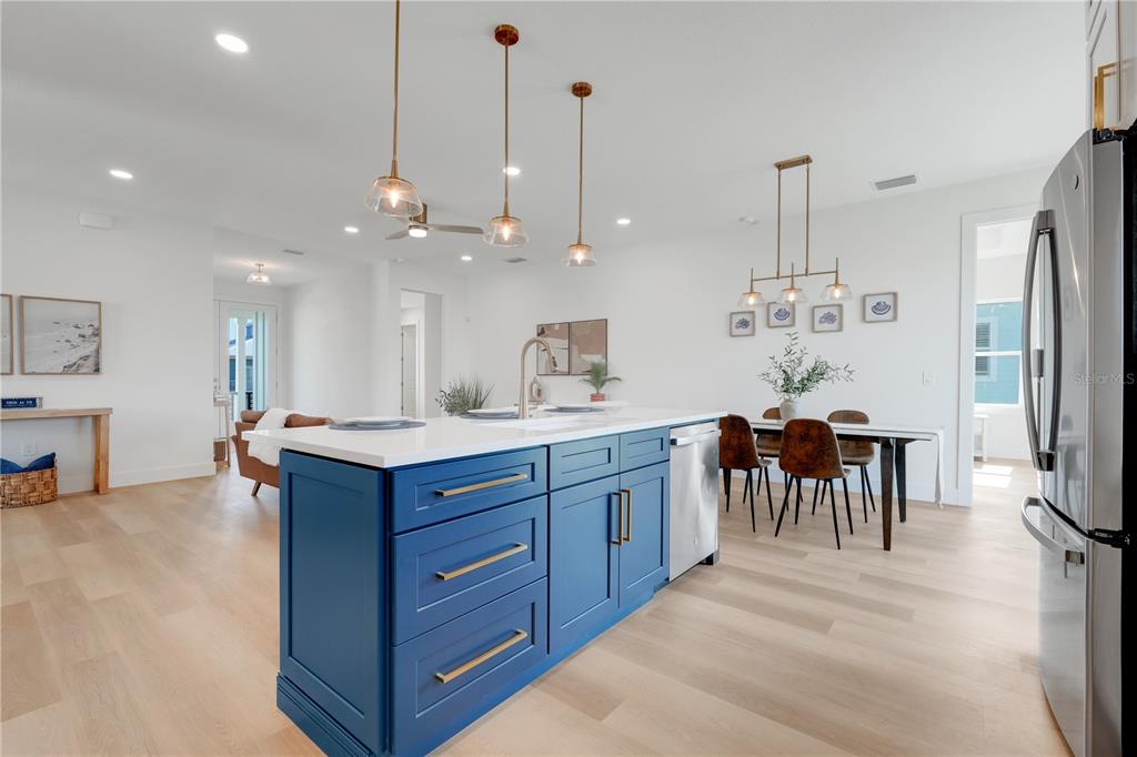 3496 Amberjack Drive Hernando Beach, FL 34607 - Photo 11 of 52 a kitchen with kitchen island a counter top space appliances and a center island