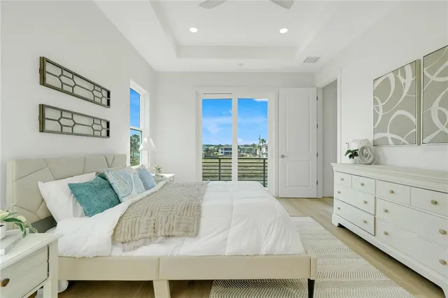 a bedroom with a large bed and dresser
