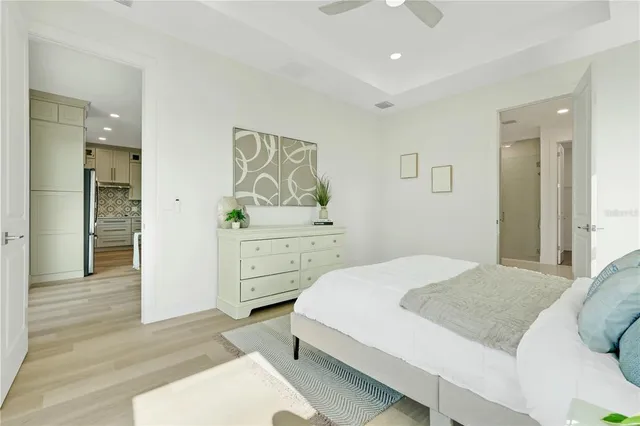 a bedroom with a bed and a table