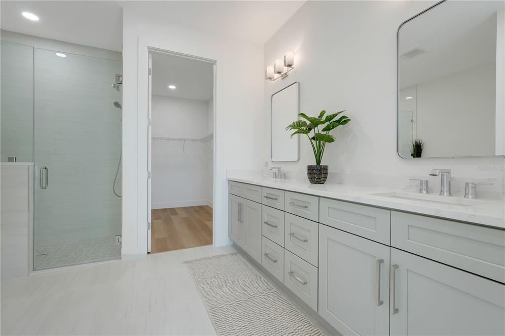 3496 Amberjack Drive Hernando Beach, FL 34607 - Photo 18 of 52 a bathroom with a granite countertop sink a mirror and a shower