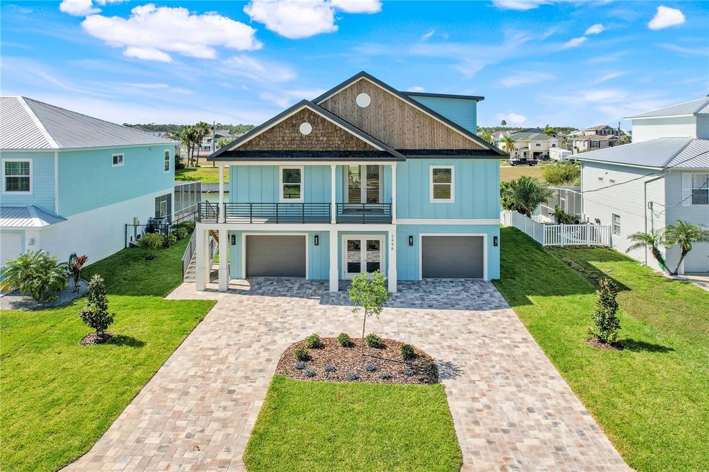 3496 Amberjack Drive Hernando Beach, FL 34607 - Photo 2 of 52 a front view of a house with a yard